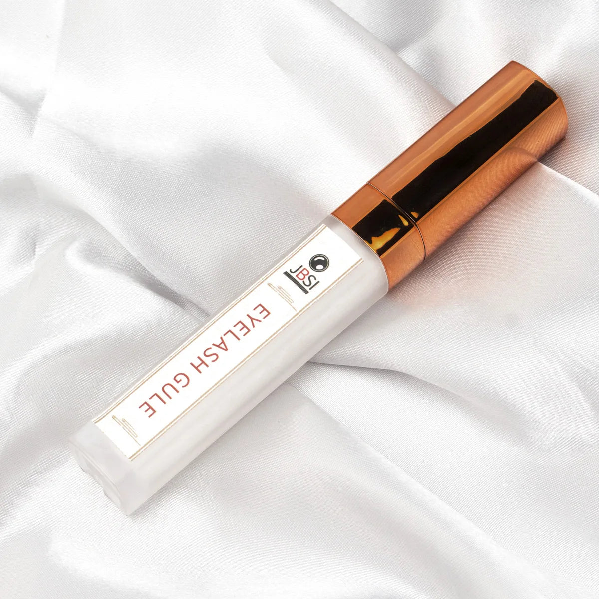 Flacon de colle à faux-cils professionnelle avec applicateur de précision, texture transparente haute adhérence.