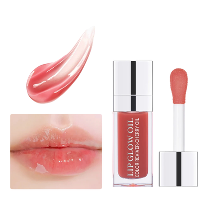 Applicateur brosse large déposant une gelée de cristal teintée à la cerise sur les lèvres