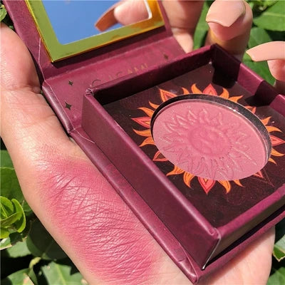 Palette duo maquillage avec poudre cuite bronzer et blush rosé, texture marbrée lumineuse.