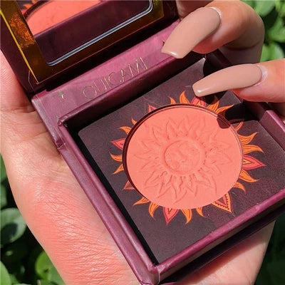 Palette duo maquillage avec poudre cuite bronzer et blush rosé, texture marbrée lumineuse.