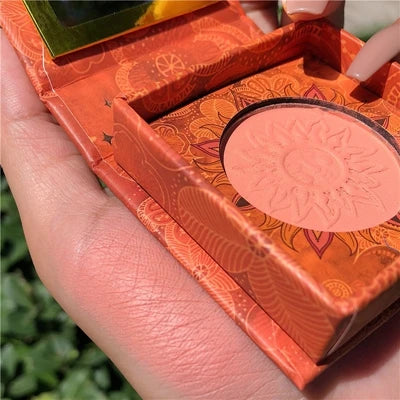 Palette duo maquillage avec poudre cuite bronzer et blush rosé, texture marbrée lumineuse.
