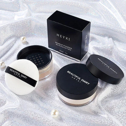 Nuage de poudre libre translucide extra-fine pour fixer le maquillage et matifier le teint.