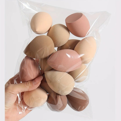 Lot d'éponges de maquillage en forme de goutte, couleurs en dégradé ombre, texture douce sans latex.
