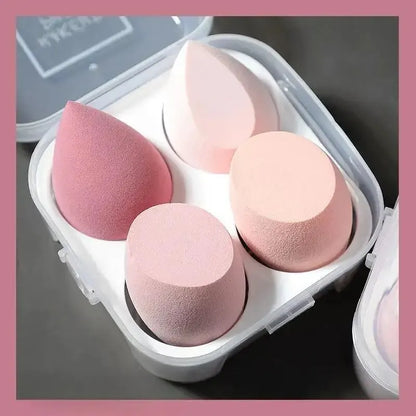 Boîtier contenant 4 éponges de maquillage en forme d'œuf de différentes couleurs pour l'application du teint.